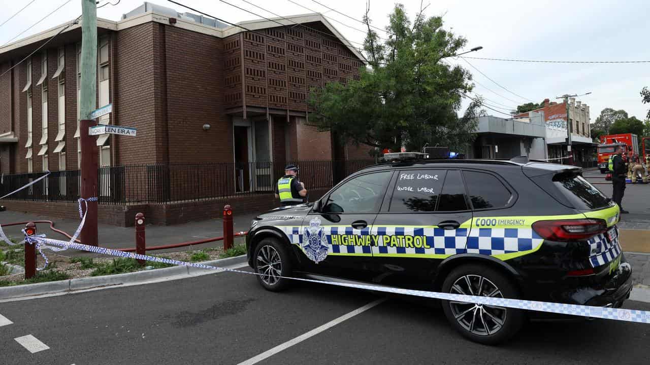 Police at the scene of a fire at the Adass Israel Synagogue