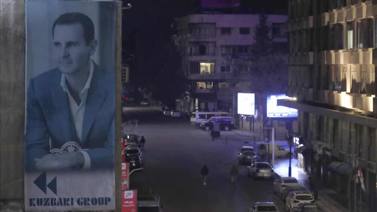 A giant banner of Syrian President Bashar al-Assad