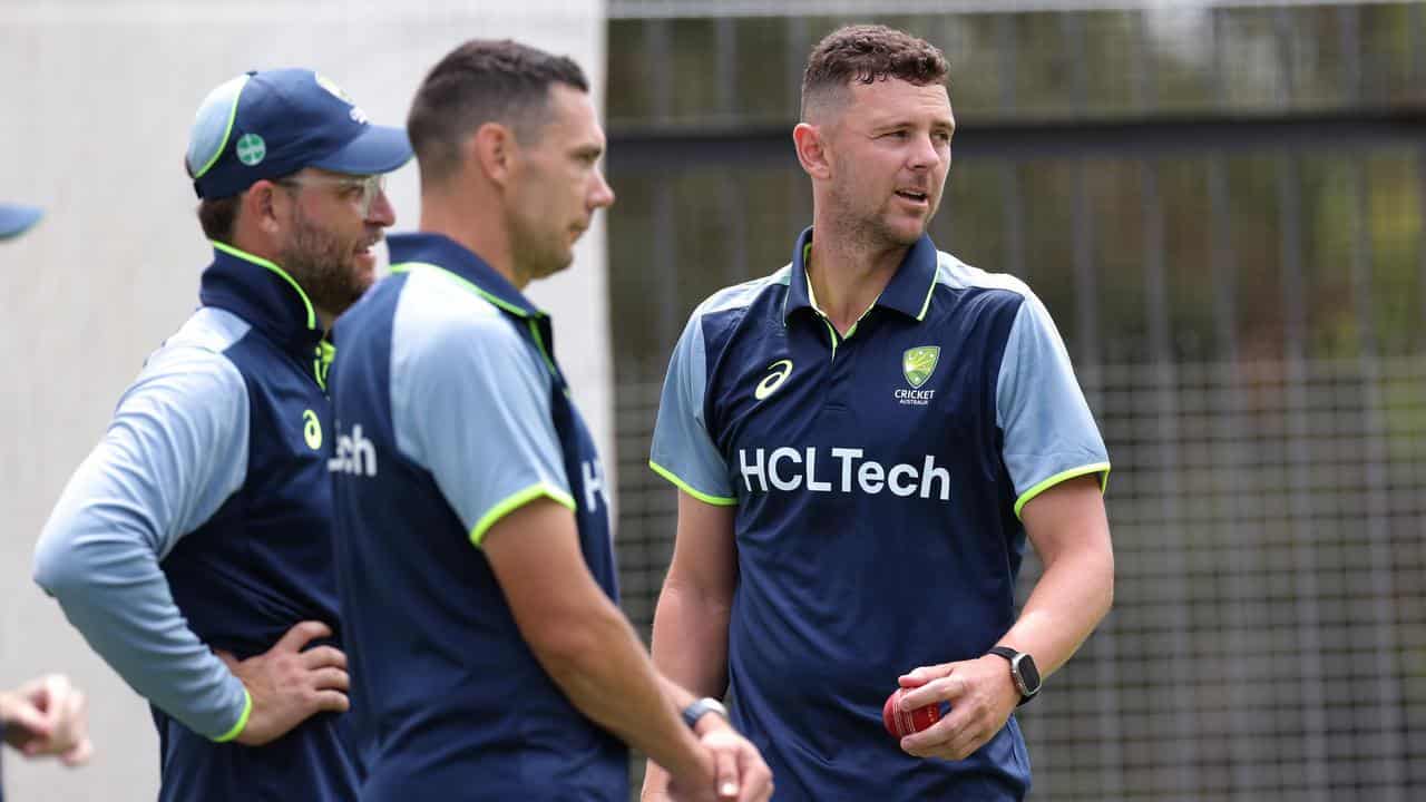 Scott Boland (centre) and Josh Hazlewood (right).