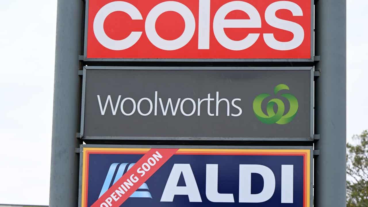 Coles, Woolworths and Aldi signs