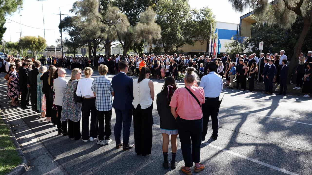 People line the street to farewell 19-year-old Holly Bowles.