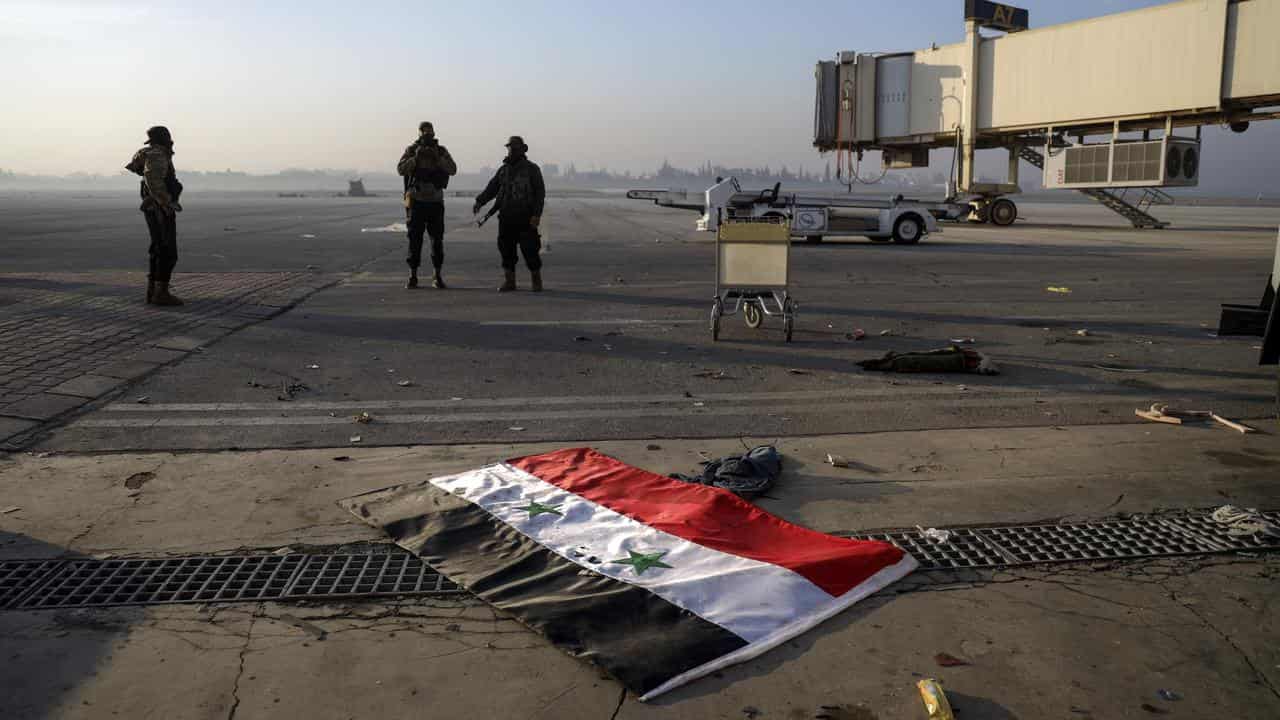 Syrian opposition fighters at the Hama military airport