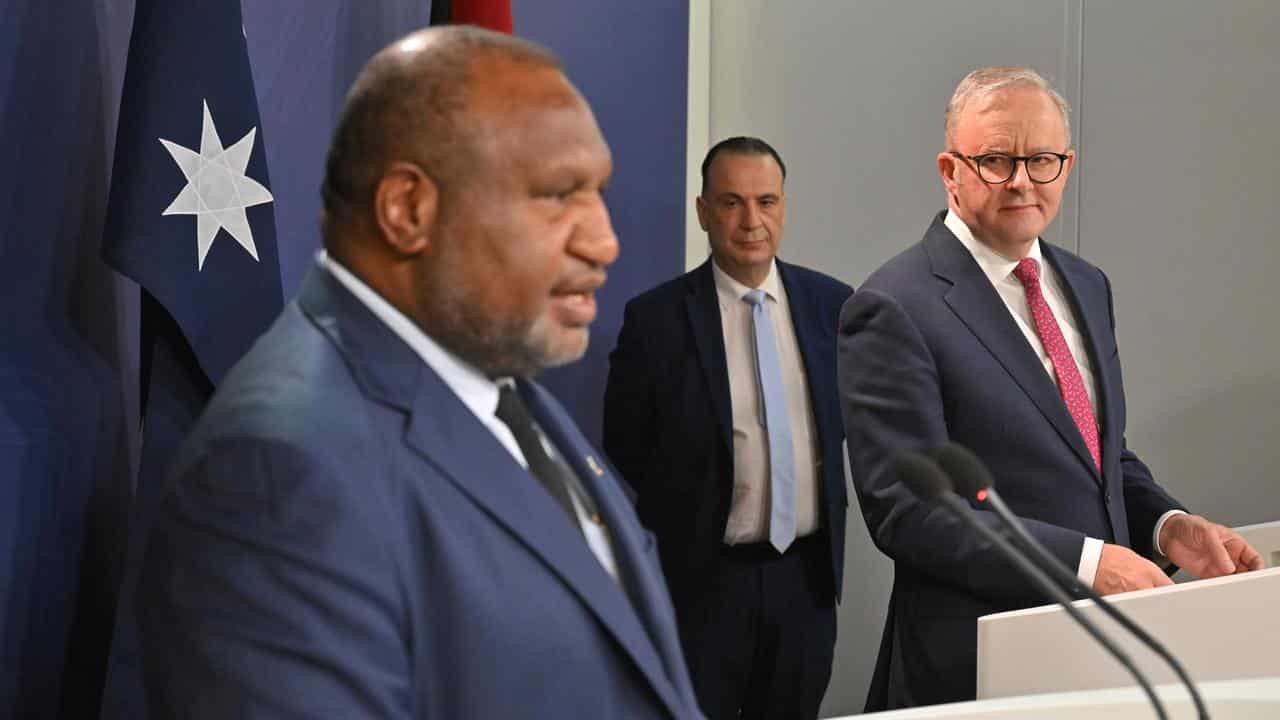 James Marape (left), Peter V'landys, Anthony Albanese.