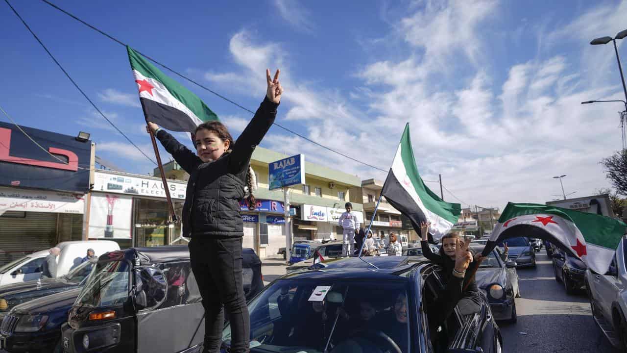 Syrians celebrate the fall of Bashar Assad's government