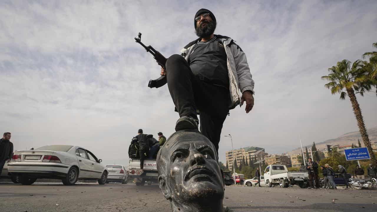 A broken bust of the late Syrian President Hafez Assad