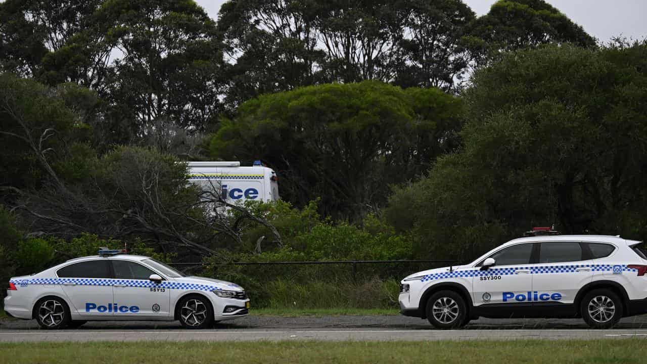 Police investigate a body found wrapped in plastic