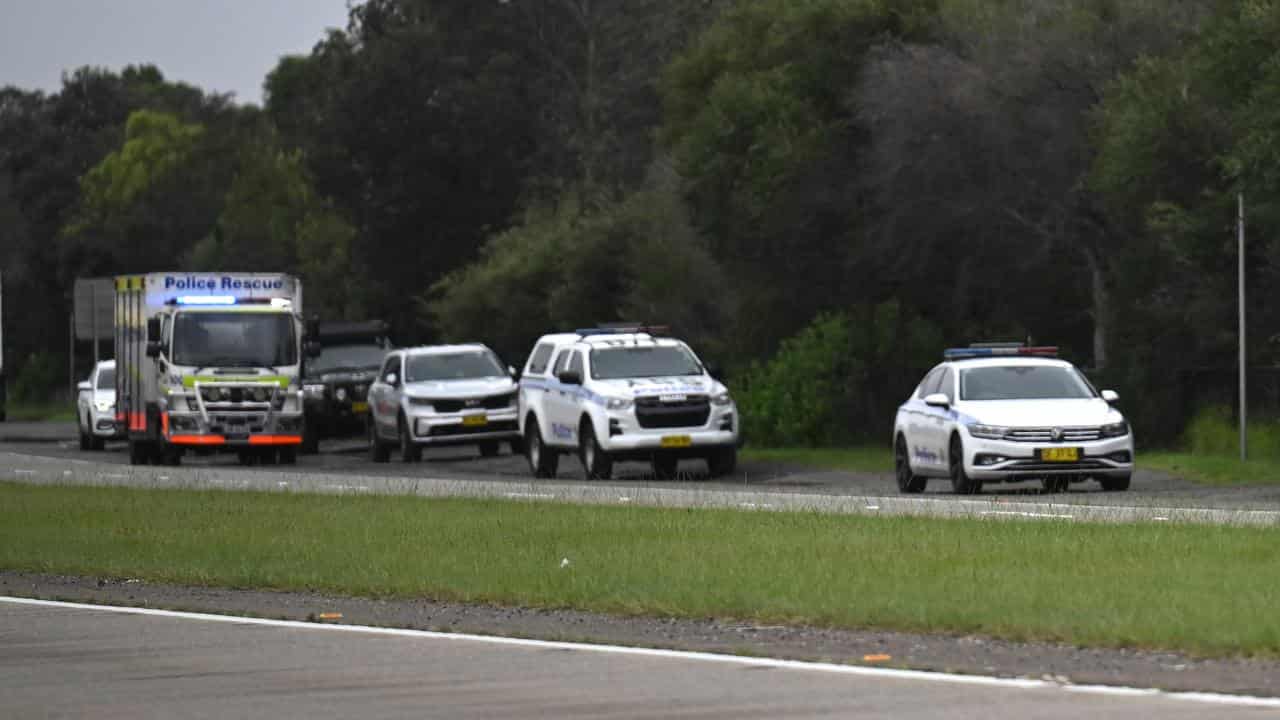 Police investigate a body found wrapped in plastic near Sydney Airport