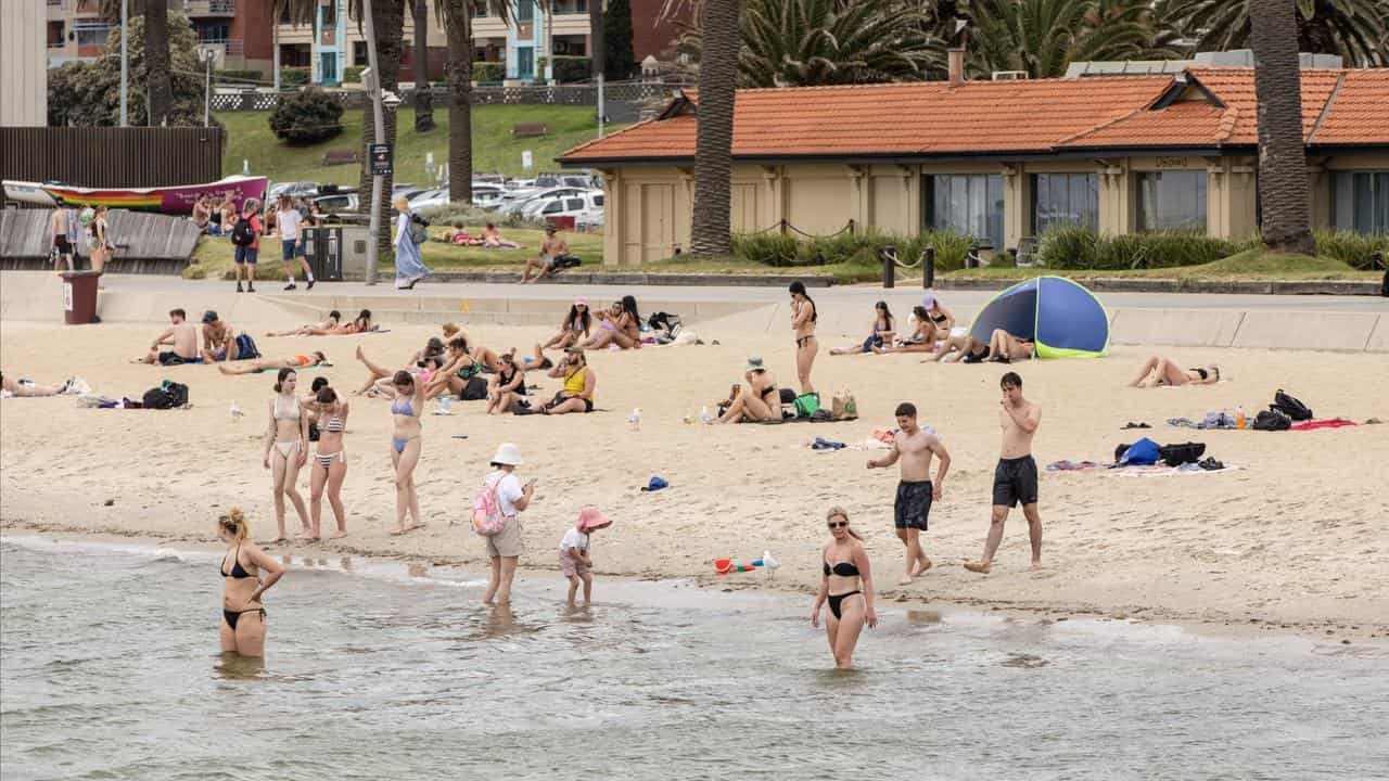 People cool off during an extreme heatwave at St Kilda