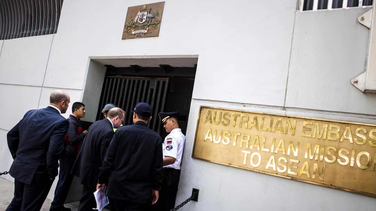 Security and guests outside the Australia embassy in Jakarta