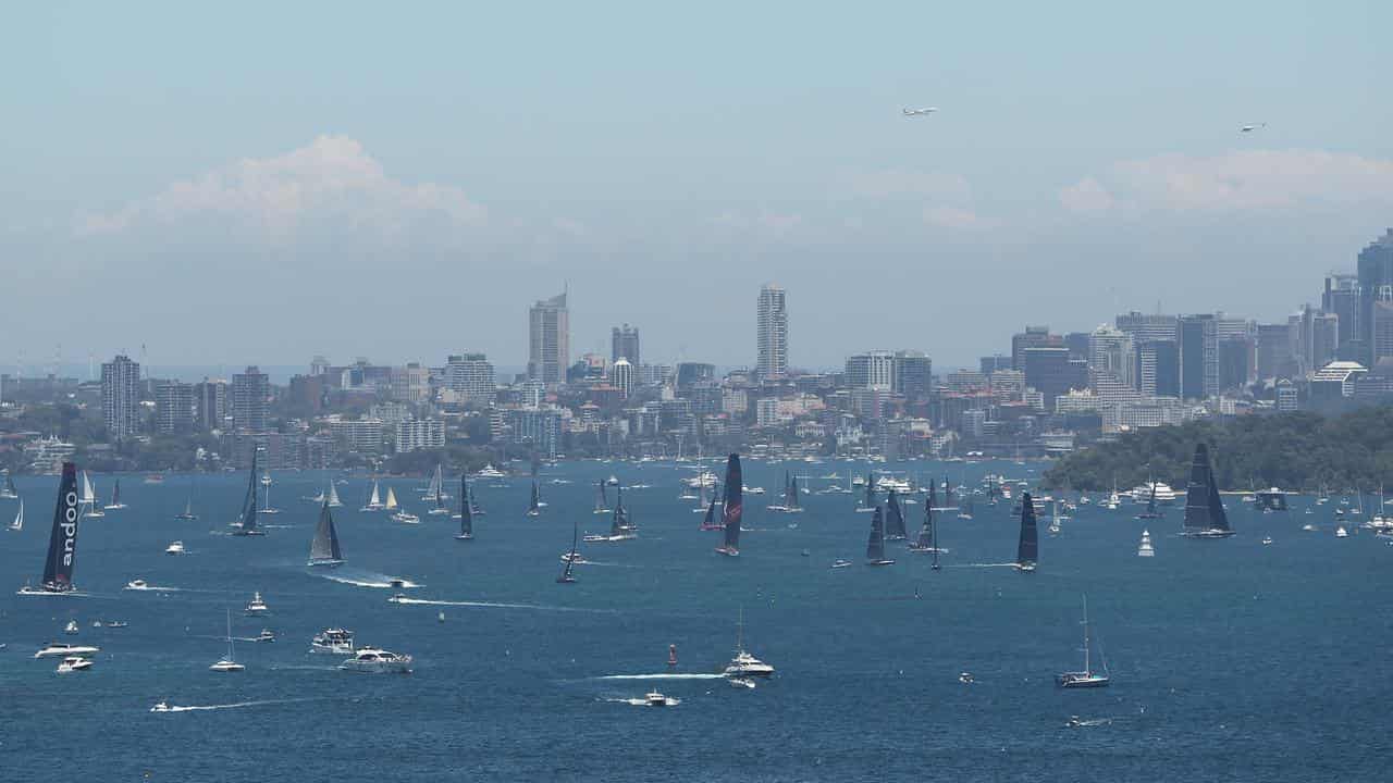 Boats jockey for position before the Sydney to Hobart yacht race.