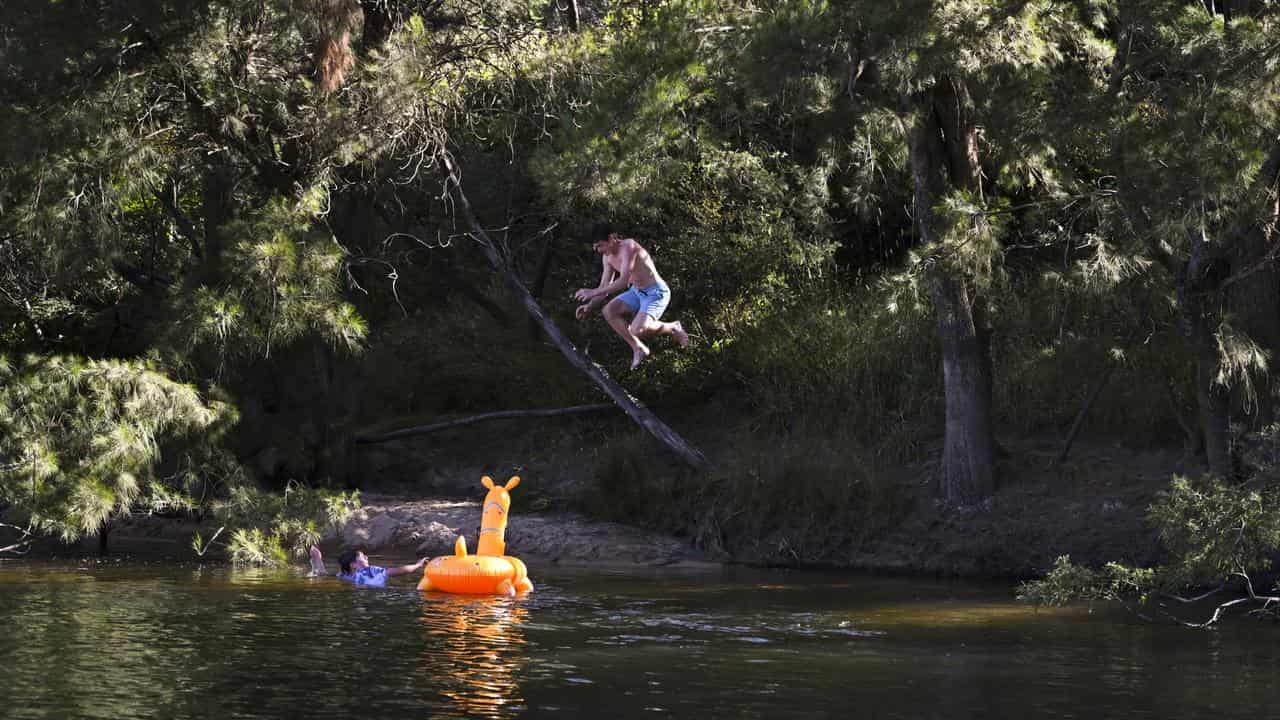 People swimming in a river