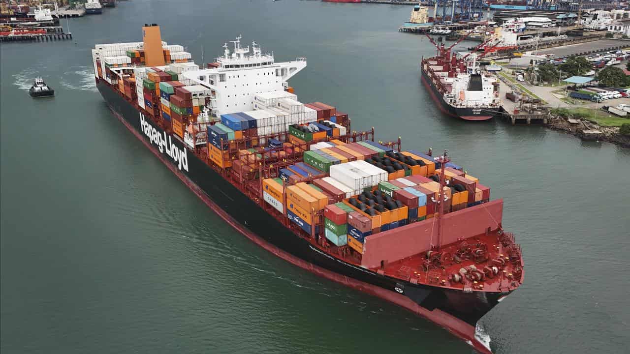 A cargo ship sails through the Panama Canal,