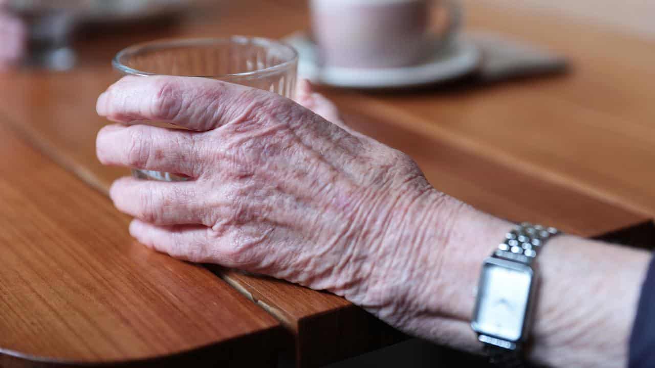 Woman with wrinkled hand