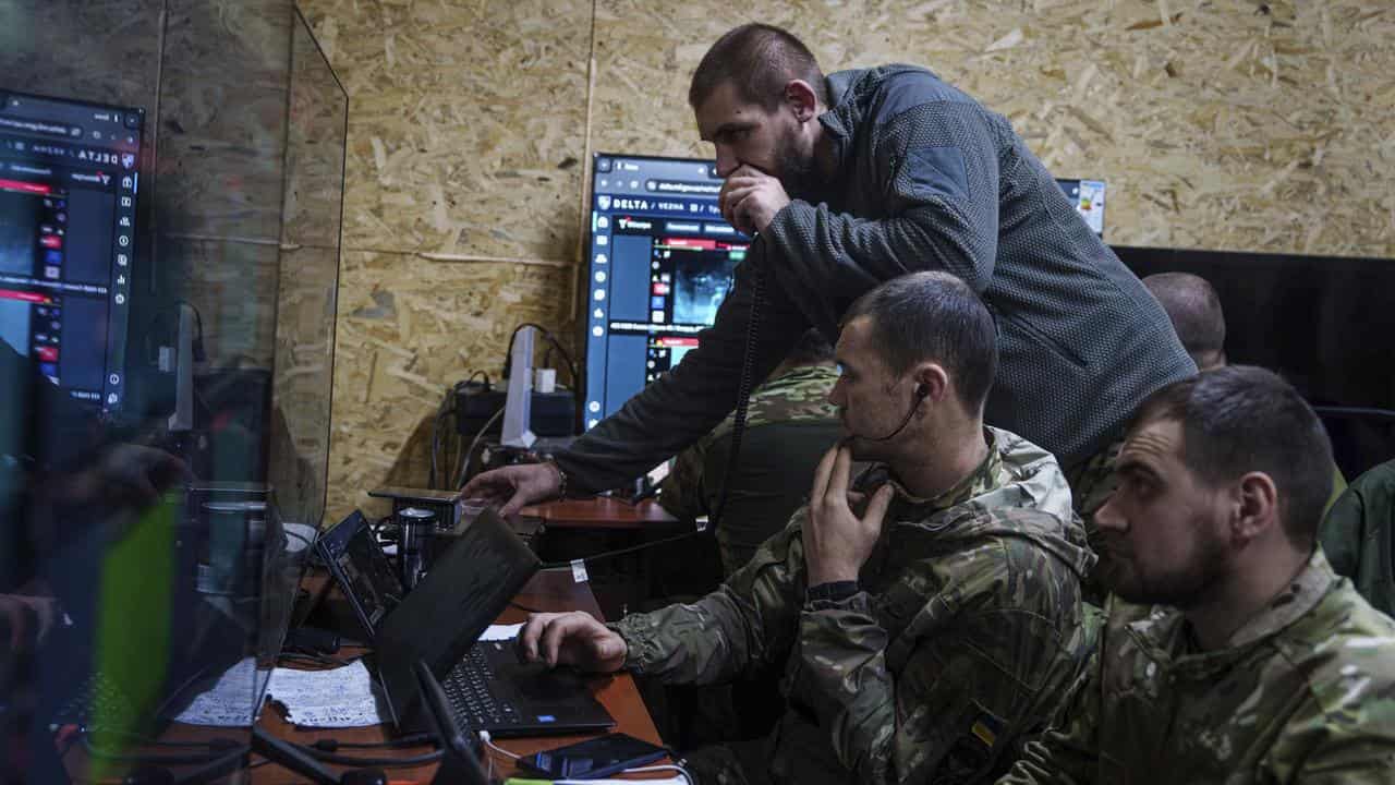 A Ukrainian officer speaks on radio to his soldiers 