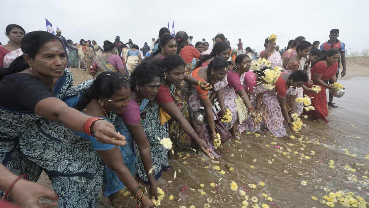 Indians in Chennai offer tributes to the victims of the 2004 tsunami