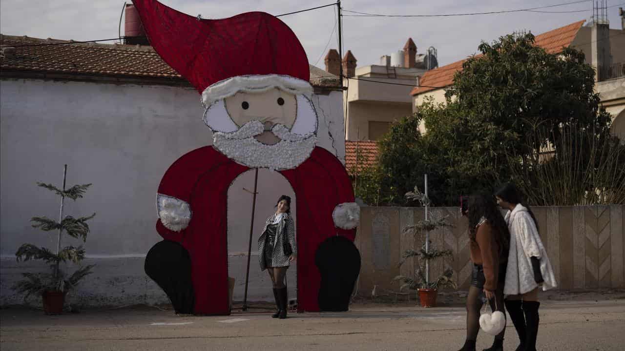 A woman with a Christmas decoration in a Christian neighbourhood