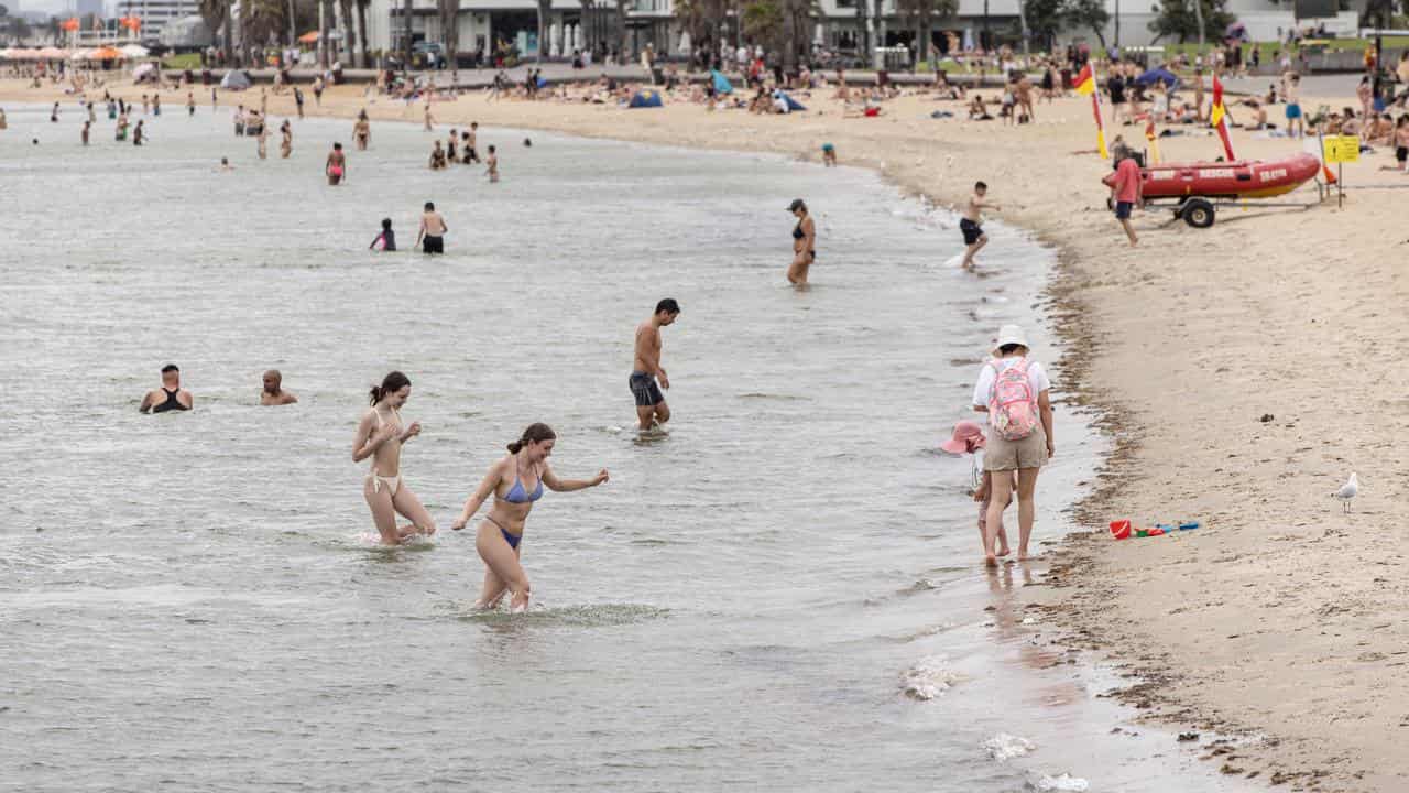 People cool off during an extreme heatwave at St. Kilda Beach