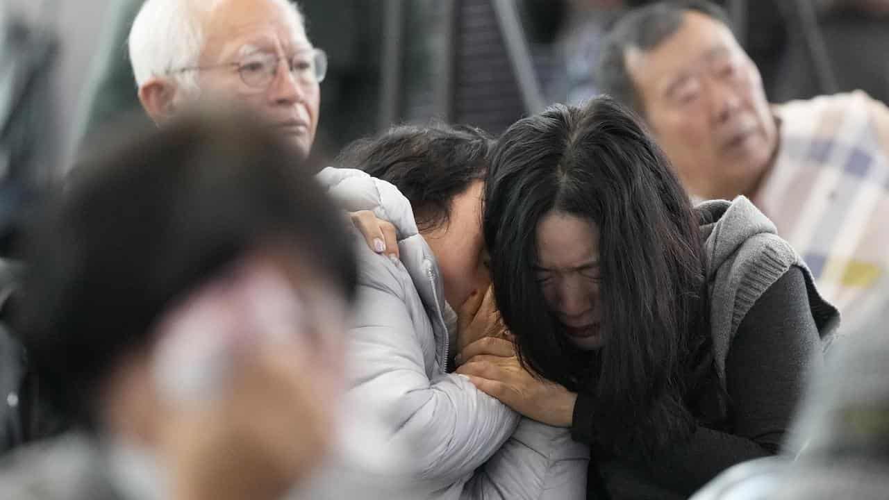 Relatives of passengers on a plane that crashed at Muan airport