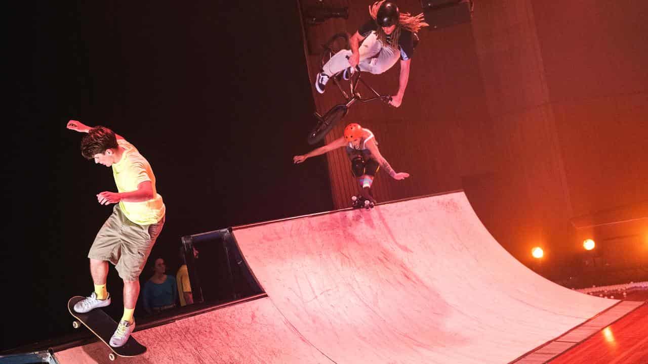 Performers show off their BMX, skateboarding and rollerblading skills.