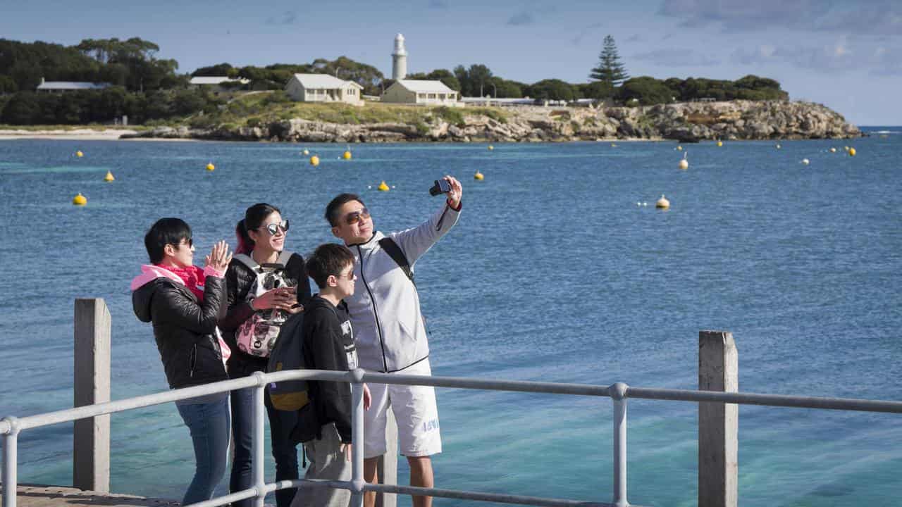 Tourists are seen taking a selfie on Rottnest Island