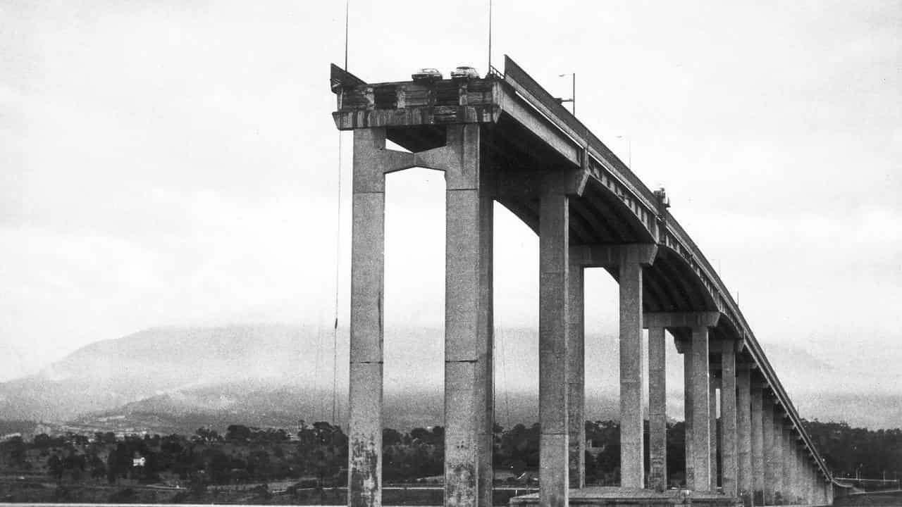 Two cars hang over the edge of the Tasman Bridge