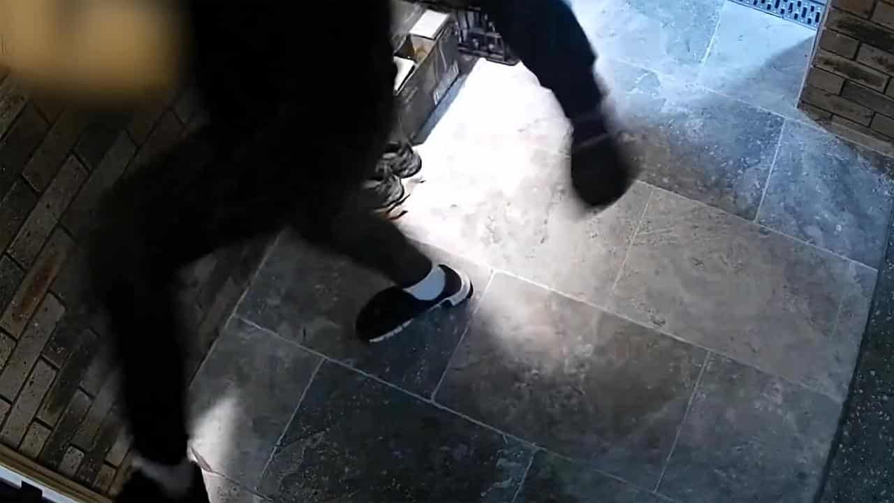 Man attempting to kick open a door during a failed home invasion