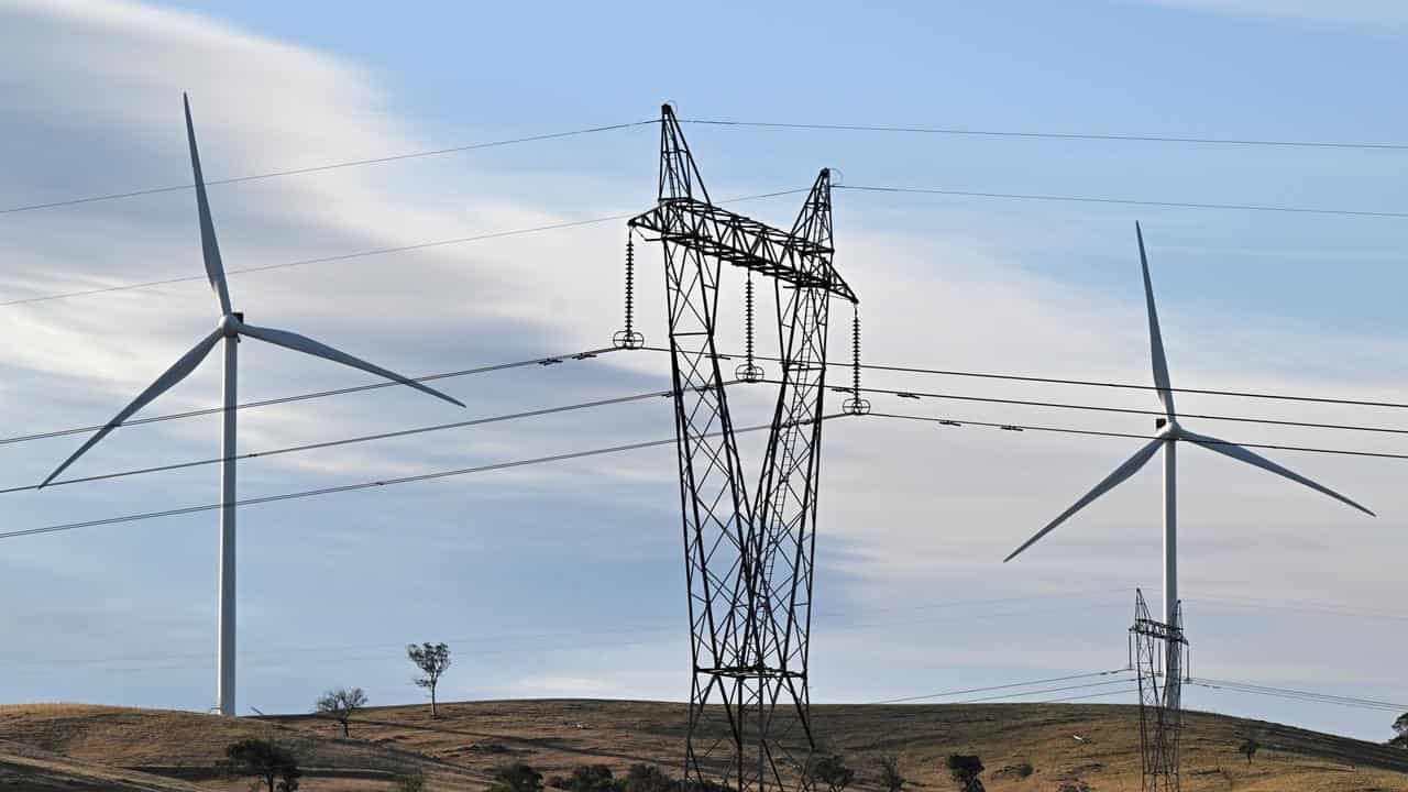 Power-generating windmill turbines and electricity pylons