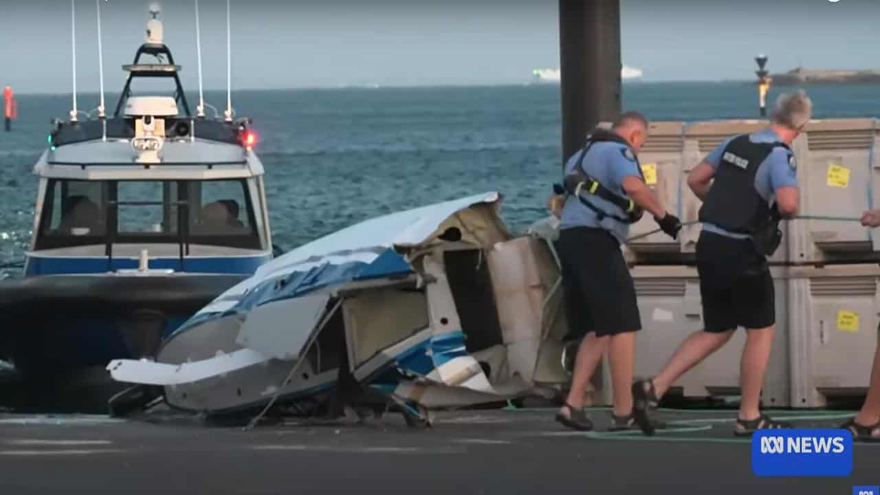 ABC screen shot of police retrieving seaplane wreckage in Thomson Bay