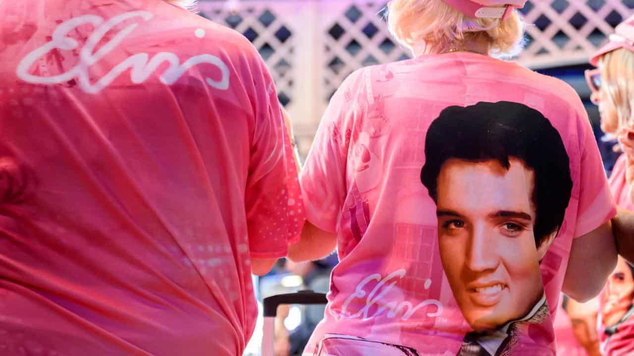 Fans wear Elvis Presley themed clothing