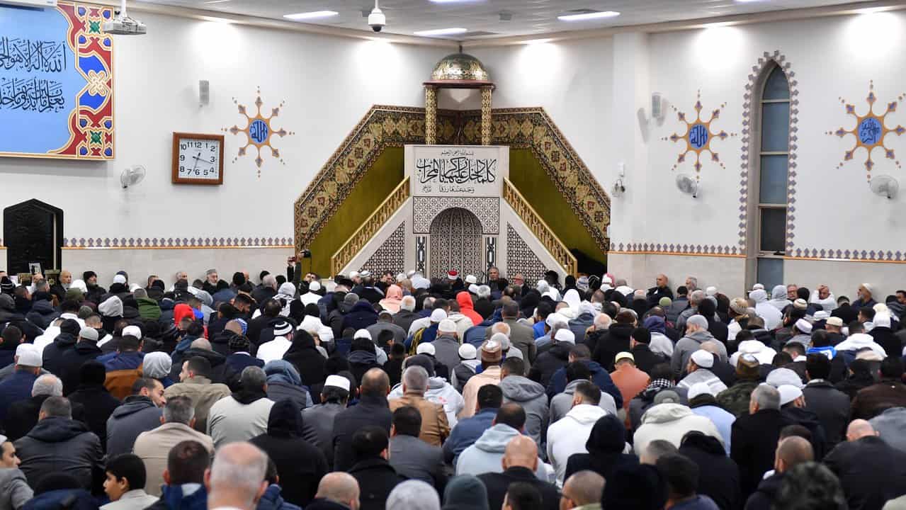 Muslim community members pray at Lakemba Mosque