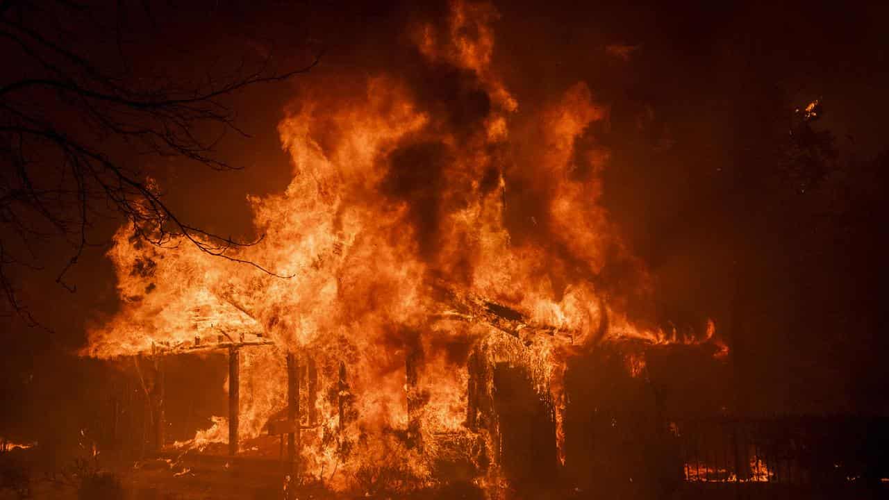 A house burns in the Eaton Fire in Altadena, California