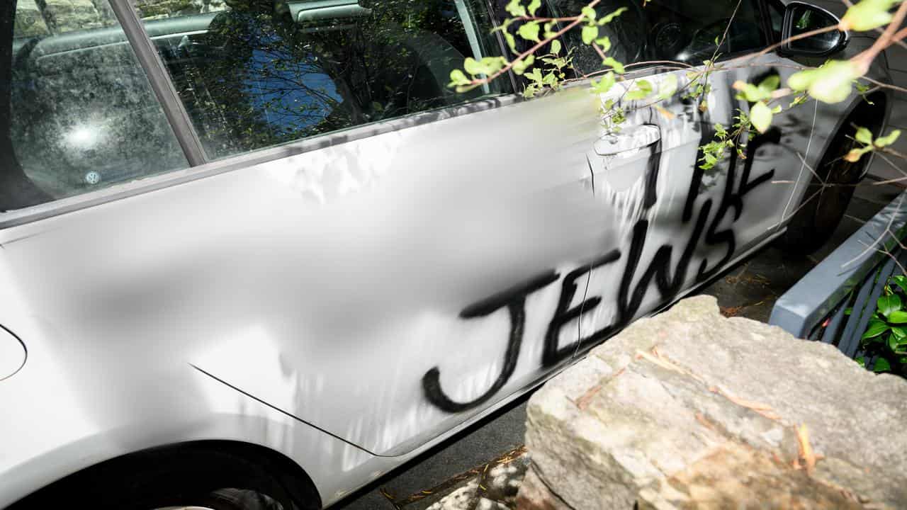 An anti-Semitic slogan daubed on a car.