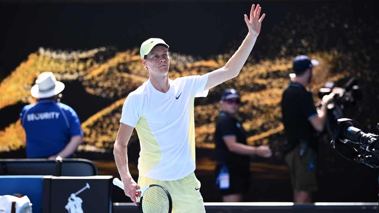 Jannik Sinner waves to crowd