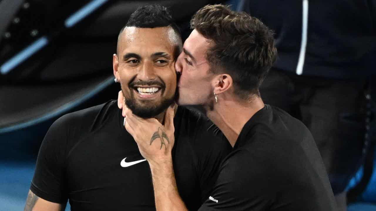 Nick Kyrgios (left) is kissed by Thanasi Kokkinakis