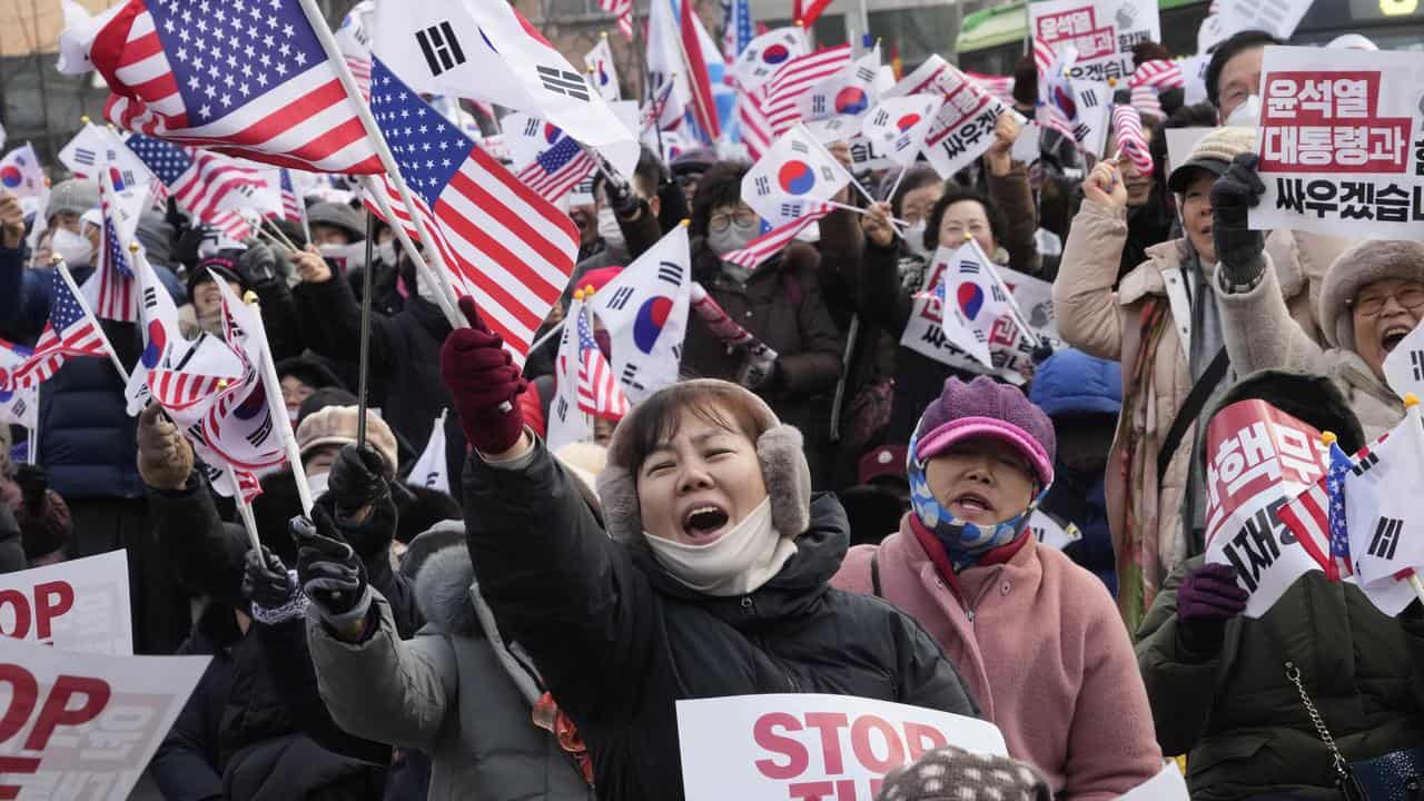 Supporters of Yoon Suk-yeol shout slogans at a rally