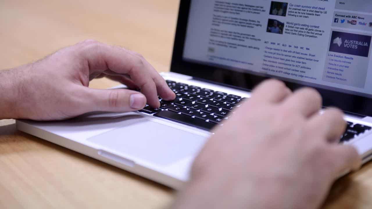 Man uses a laptop computer