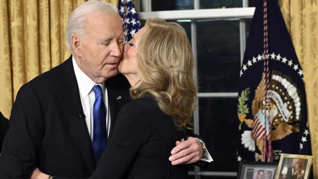 President Joe Biden hugs first lady Jill Biden