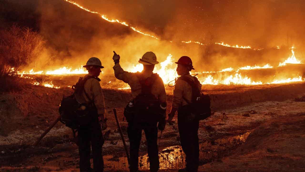 Fire crews battle the Kenneth Fire in Los Angeles