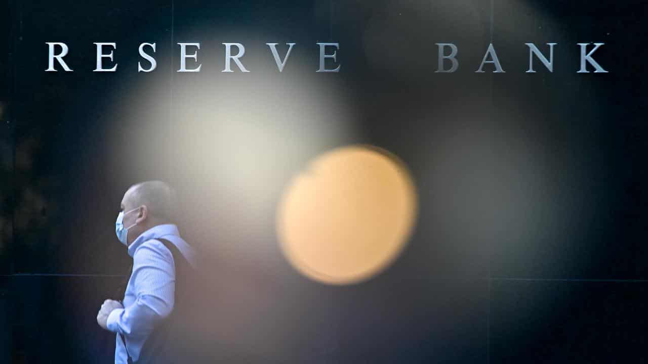 Person walks past the Reserve Bank of Australia