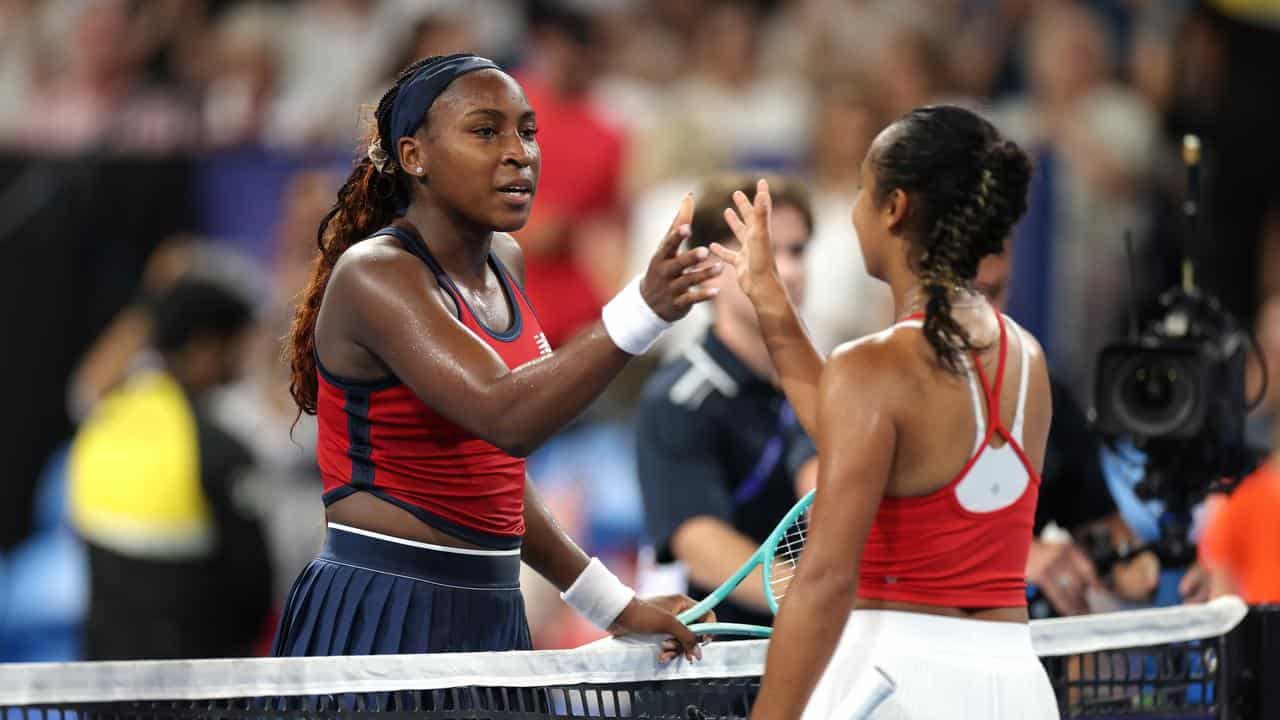 Coco Gauff (left) and Leylah Fernandez shake hands.