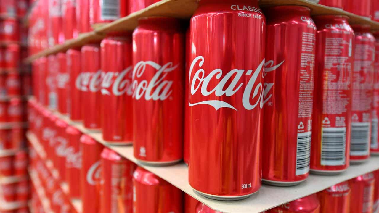 Cans of coke at a Melbourne factory