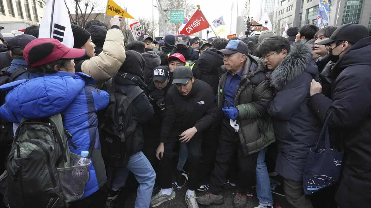 Supporters of South Korean President Yoon Suk-yeol scuffle with police