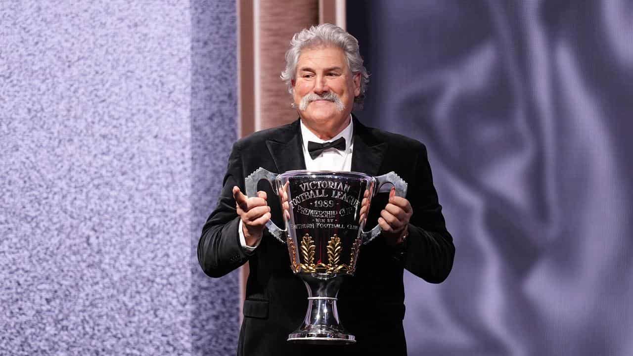 Robert DiPierdomenico holds a Premiership Cup