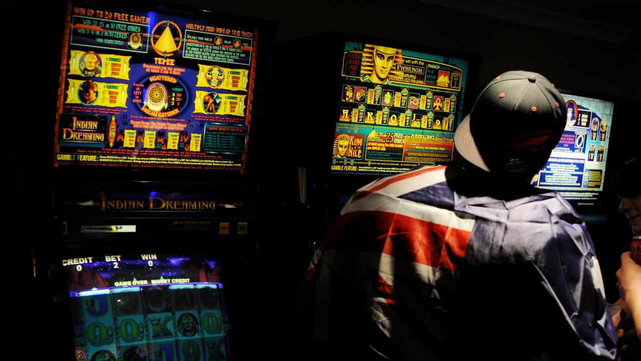 A man plays the poker machines (file image)