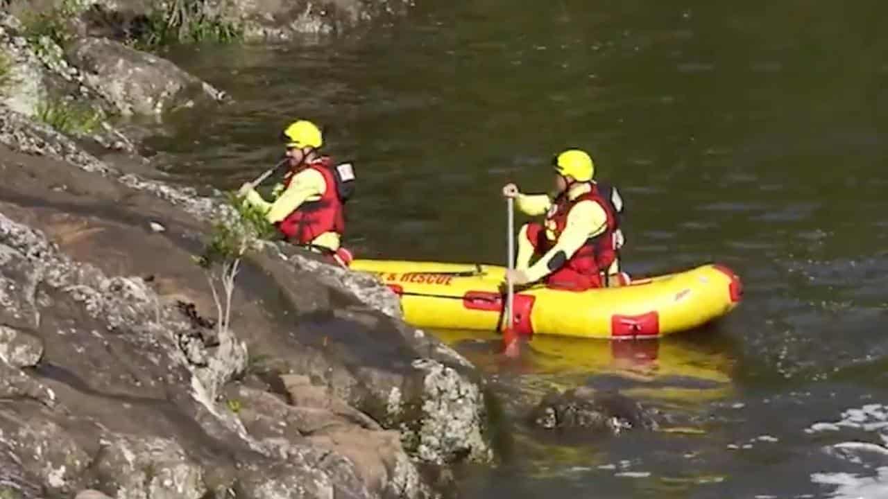 Searchers row at a swimming spot on the Sunshine Coast