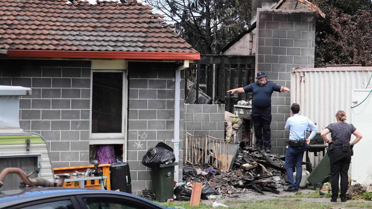 Investigators at the home 