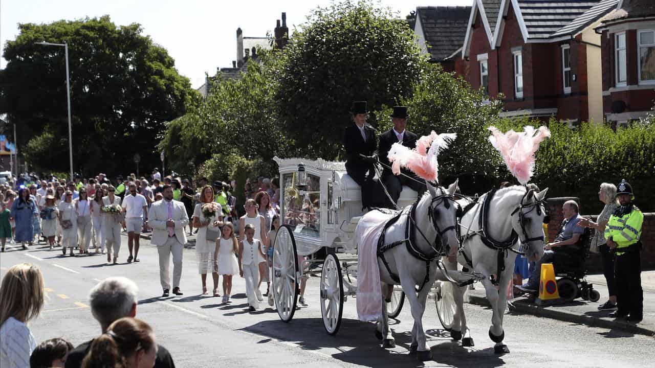 The funeral cortege for Alice da Silva Aguiar