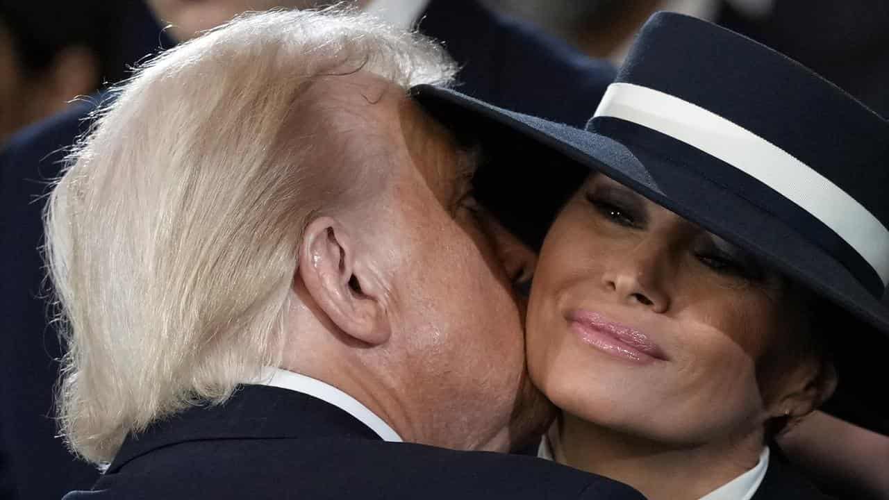 President Donald Trump kisses first lady Melania Trump