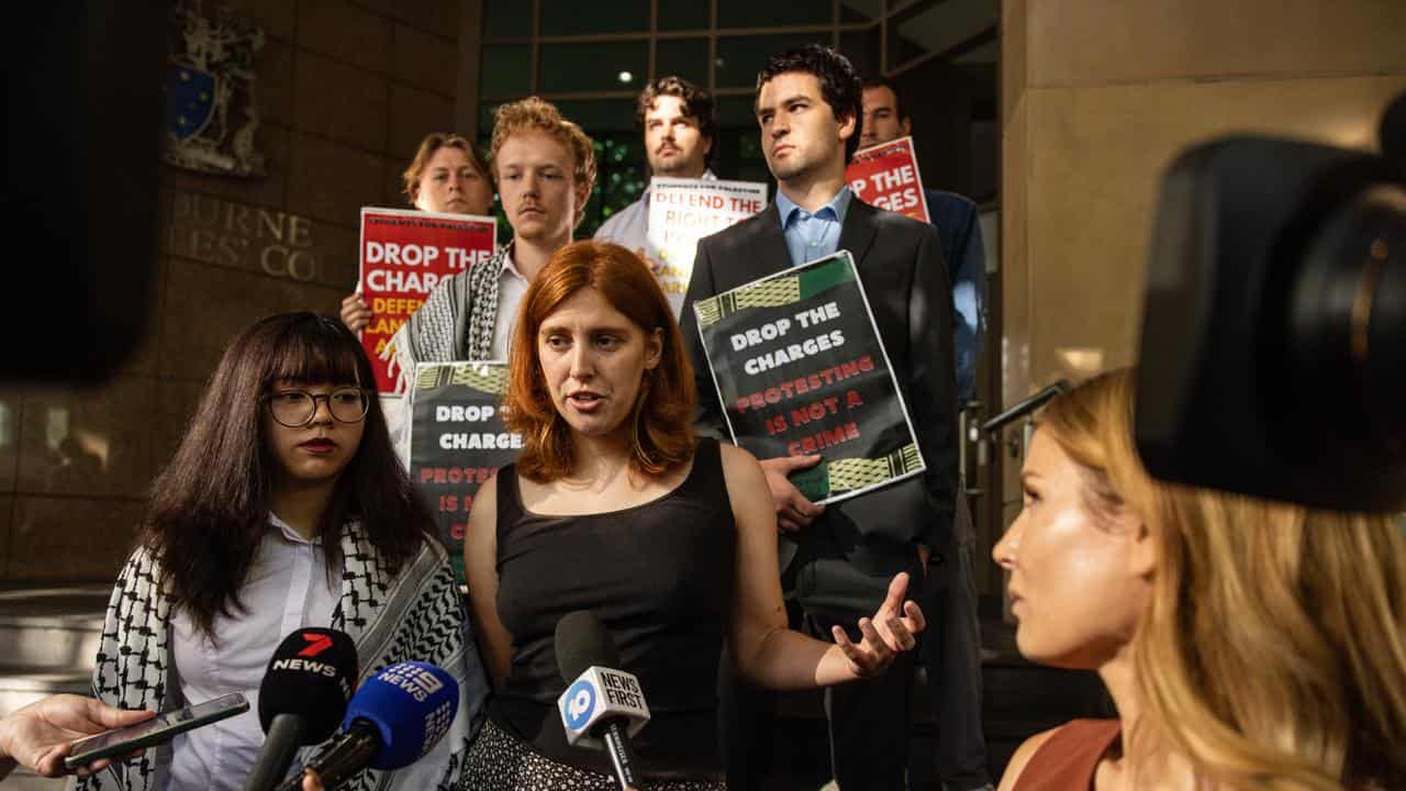 Members from Students for Palestine speak to media outside court