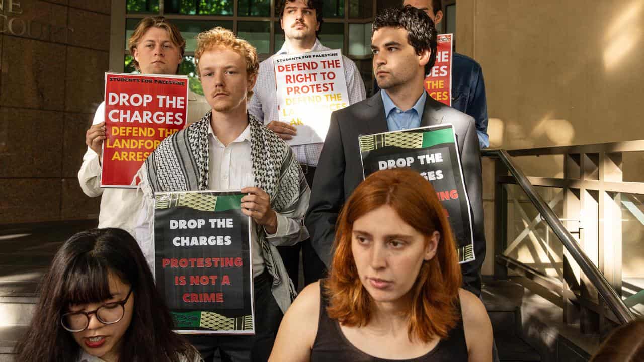 Students for Palestine members speak outside court